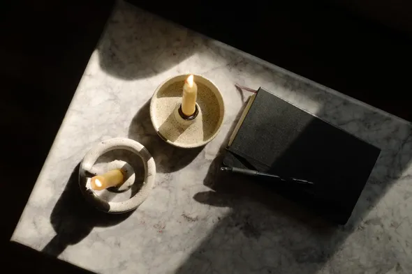 Notebook with Candles - Everwell Counselling & Wellness